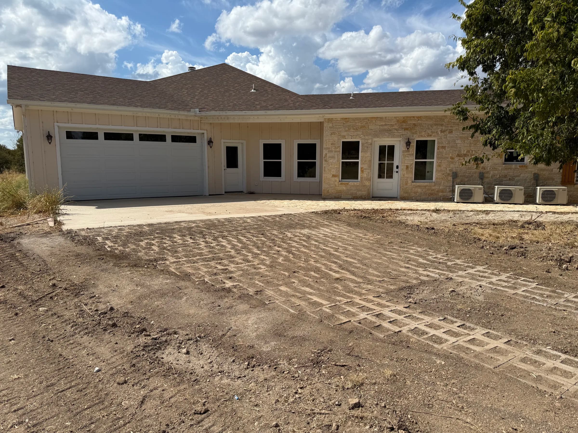 Open-cell concrete driveway approaching the garage at White Hall